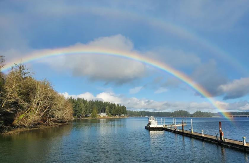 A double rainbow captured in the South Sound during a coho net pen transfer